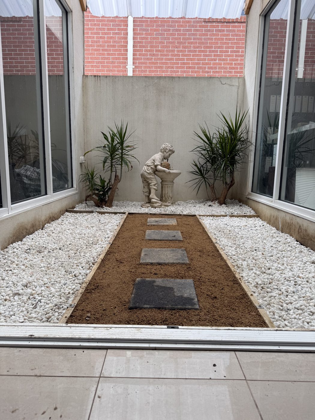 Tidy landscaped courtyard after EKO