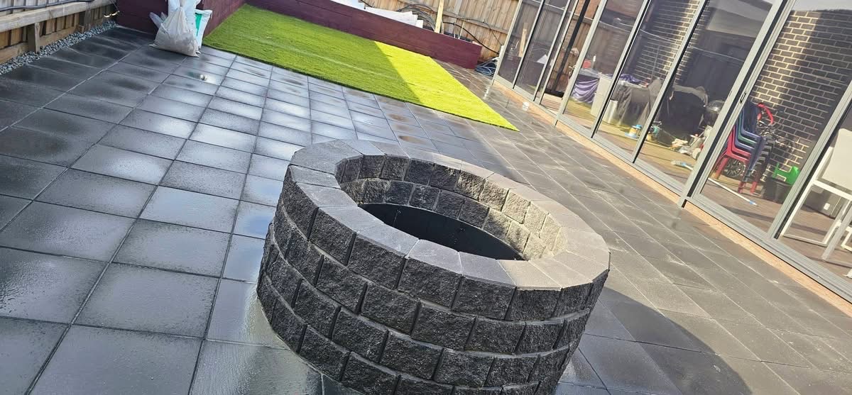 Paved firepit feature within a completed EKO landscape