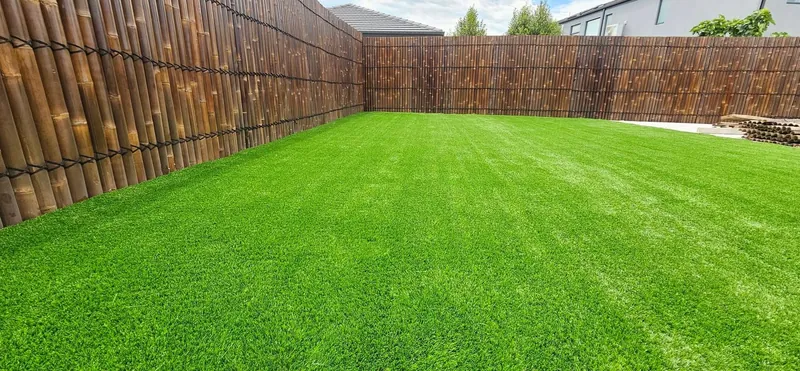 Completed synthetic turf and poolside landscaping by EKO